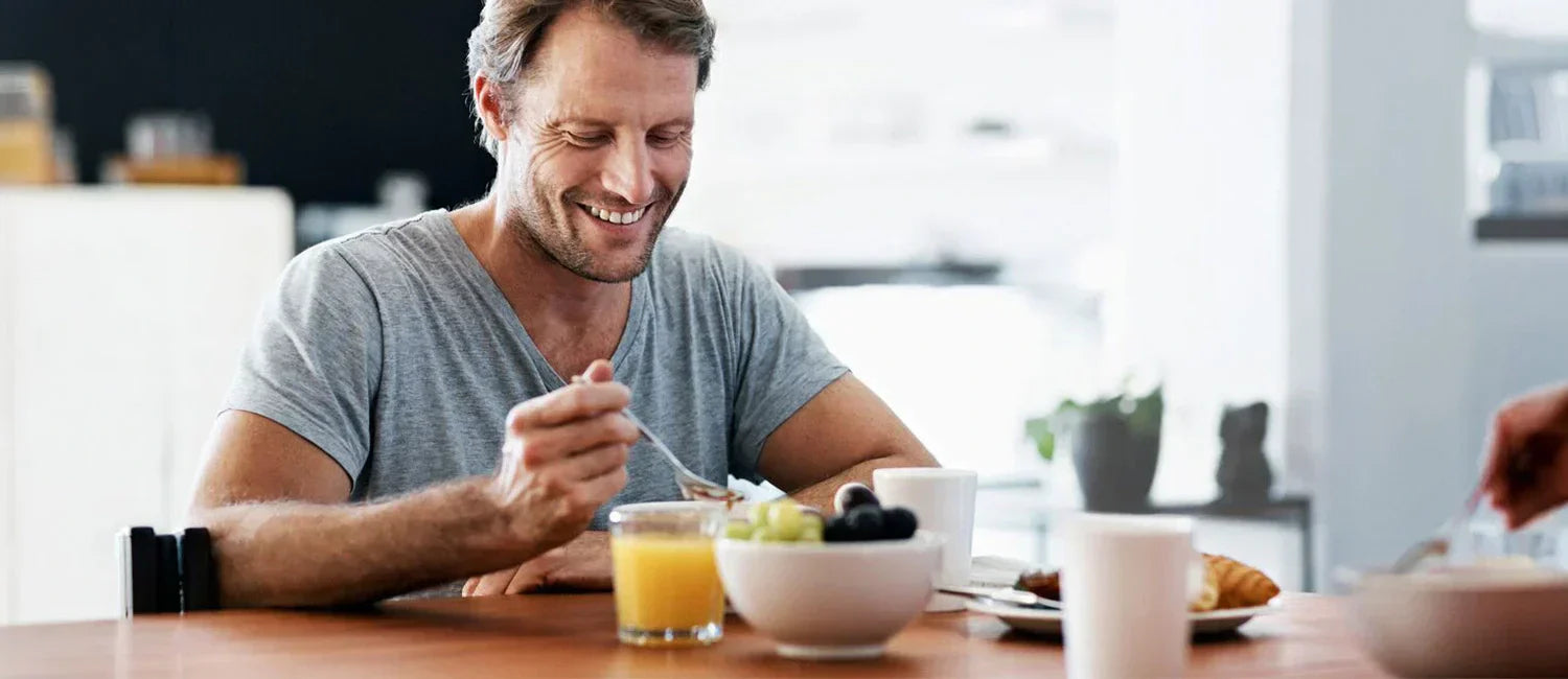 Man taking oral collagen supplement with breakfast for skin and joint health benefits