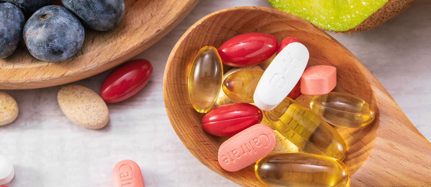 Assorted daily health supplements including capsules, tablets and omega-3 softgels